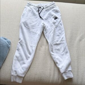 White Nike Tech Sweatpants with Black Drawstring and Logo